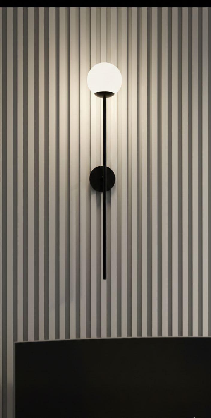astro orb single wall light in a matt black finish with a spherical glass diffuser astro orb single wall light in a matt black finish with a spherical glass diffuser